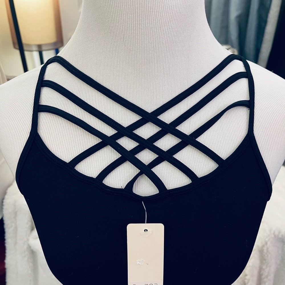 Spandex tank with cross front detail.